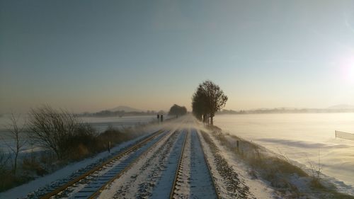  railway tracks in countryside during winter