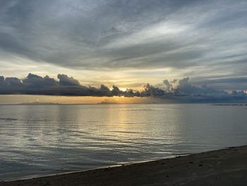 Scenic view of sea against sky at sunset