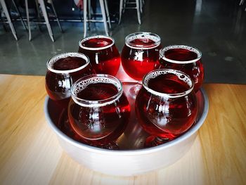 High angle view of drinks in wineglasses at table