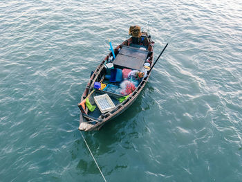 High angle view of fishing equipment in boat