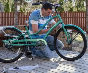 Side view of young man riding bicycle