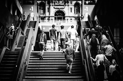 High angle view of people walking on escalator