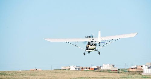 Airplane against clear sky