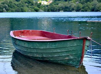 Boat moored in lake