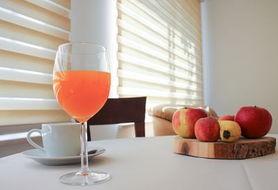 Various fruits in plate on table