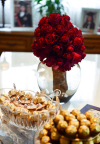 Close-up of roses in vase on table