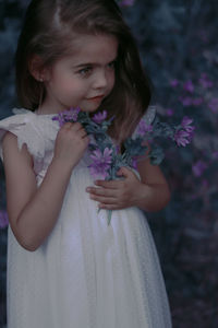 Portrait of a girl with pink flower