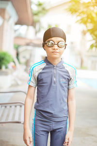 Portrait of teenage boy standing outdoors