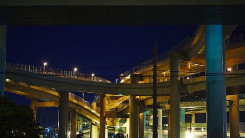 Illuminated lamp post at night
