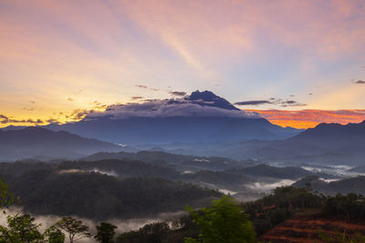 Scenic view of mountains against sky during sunset