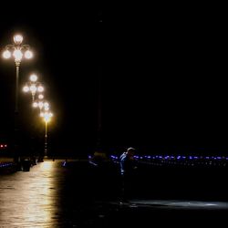 Illuminated street light at night
