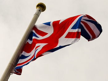 Low angle view of flag against sky