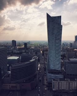 Cityscape against cloudy sky