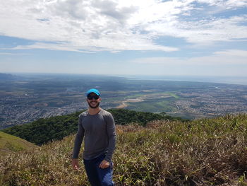 Full length of man on mountain against sky