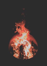 Close-up of bonfire against black background