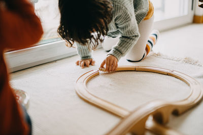 Girl playing with toy at home