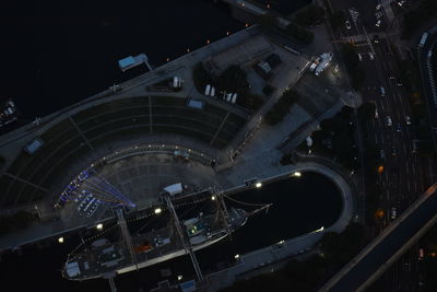 High angle view of city lit up at night