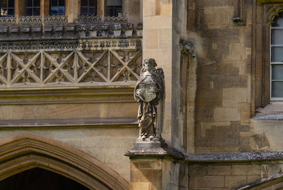 Low angle view of statue against building