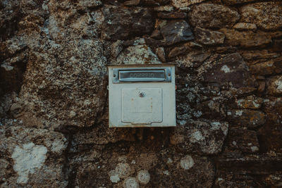 Close-up of mailbox on wall