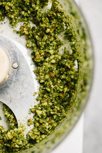 Making basil pesto macro closeup