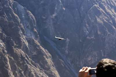Airplane flying over mountain