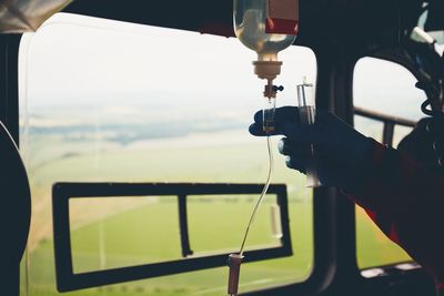 Close-up of hand holding iv drip