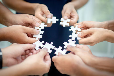 Midsection of man holding hands