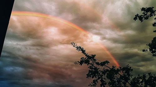Low angle view of rainbow against sky