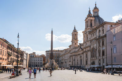 Piazza navona and fontana dei quattro fiumi by bernini, baroque church sant'agnese in agone