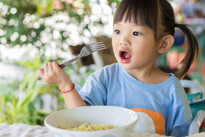 Portrait of girl eating food