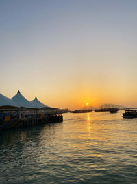 Scenic view of sea against clear sky during sunset