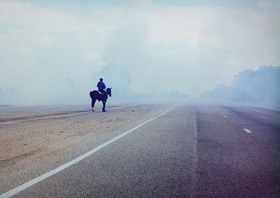 Man walking on road