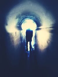 Blurred motion of woman in tunnel