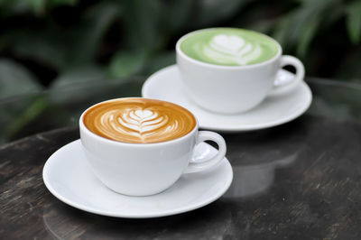 Close-up of cappuccino served on table