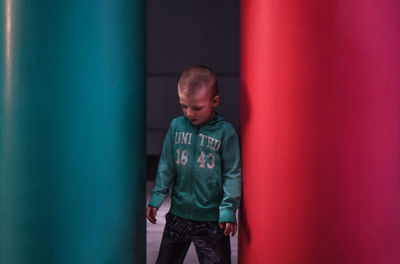 The boy between the colored columns