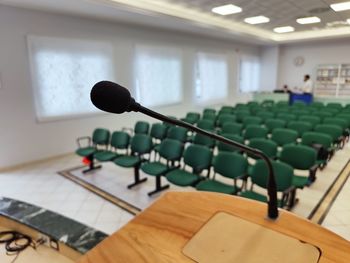Empty seats and microphone in hall auditorium 
