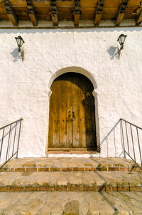 Exterior of house with closed door during sunny day