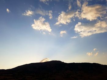 High section of mountains against blue sky