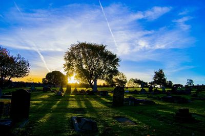 Scenic view of landscape against sky at sunset