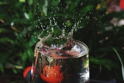 Close-up of water splashing in glass