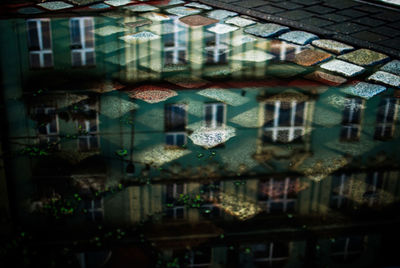 Reflection of buildings on puddle