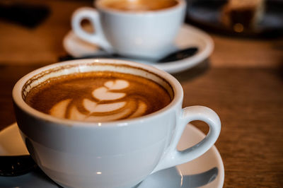 Close-up of coffee cup on table