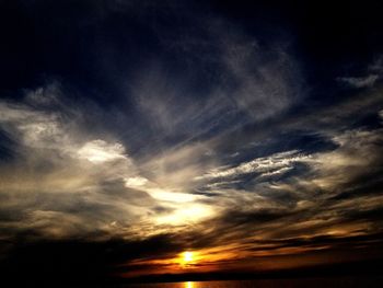 Low angle view of dramatic sky during sunset