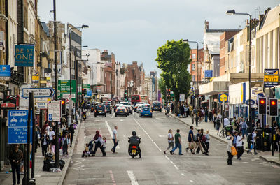 Group of people walking on city street