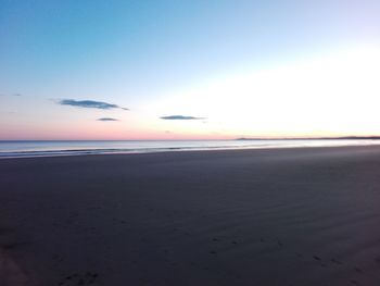 Scenic view of beach at sunset