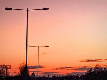 Low angle view of street light against sky during sunset