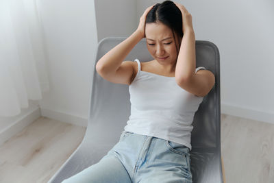 Young woman exercising at home