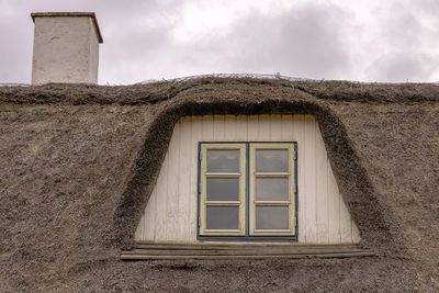 Low angle view of built structures against sky