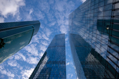 Low angle view of modern buildings against sky