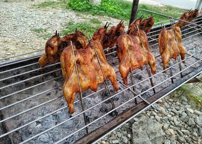 High angle view of meat on barbecue grill